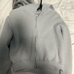 jojo&co cropped zip up, light blue, size small